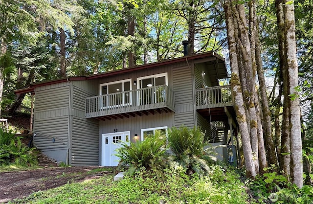 50 Lake Louise Dr, Bellingham, WA 98229 - back of house featuring stairway, a balcony, and faux log siding