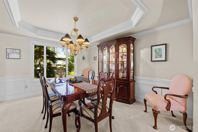 3924 Montgomery Ct, Mount Vernon, WA 98274 - dining area with light colored carpet, a chandelier, ornamental molding, a wainscoted wall, and a raised ceiling