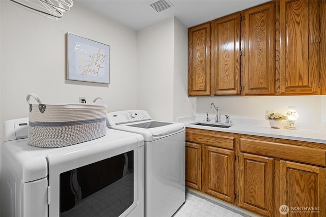 3924 Montgomery Ct, Mount Vernon, WA 98274 - washroom featuring separate washer and dryer, cabinet space, and light flooring