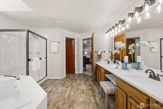 3924 Montgomery Ct, Mount Vernon, WA 98274 - full bath featuring double vanity, a shower stall, a garden tub, marble look tile flooring, and baseboards