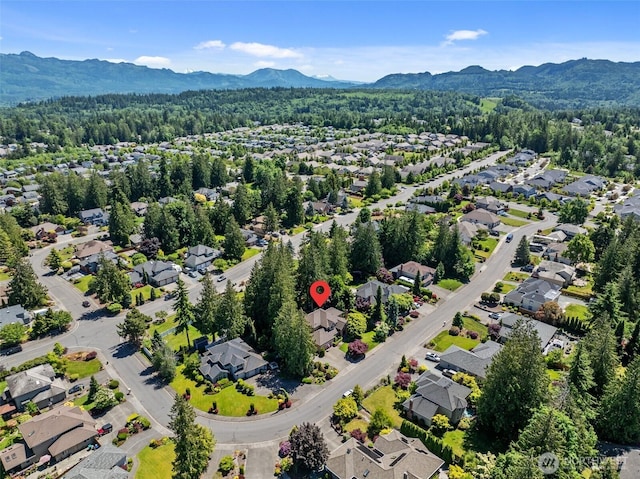 3924 Montgomery Ct, Mount Vernon, WA 98274 - aerial perspective of suburban area featuring a mountain backdrop and a forest