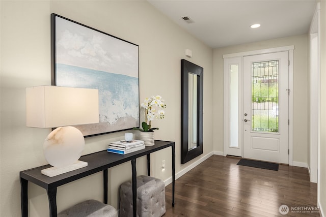 entrance foyer featuring dark wood-style flooring, baseboards, and recessed lighting