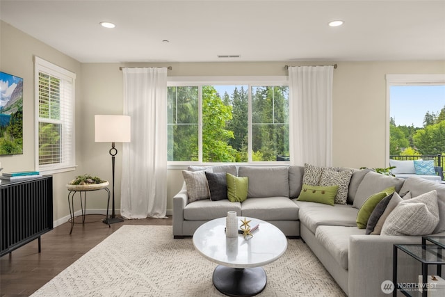 living area featuring wood finished floors, recessed lighting, and baseboards