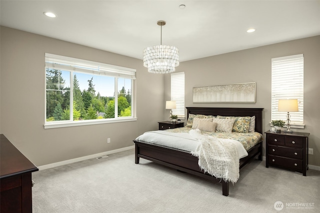 carpeted bedroom featuring a chandelier, baseboards, and recessed lighting