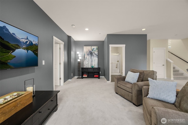 living area with light carpet, stairway, baseboards, and recessed lighting