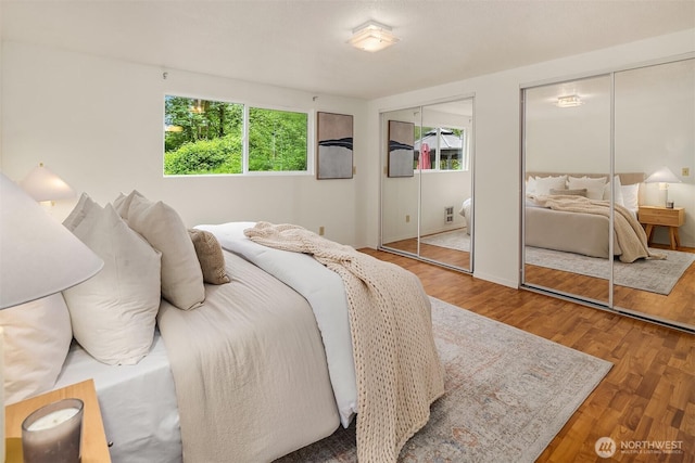 23516 20th Ave W, Bothell, WA 98021 - bedroom featuring multiple closets and wood finished floors