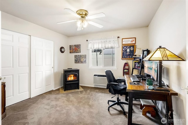 1811 Hundley Rd, Cle Elum, WA 98922 - office featuring a wood stove, ceiling fan, carpet floors, and baseboards
