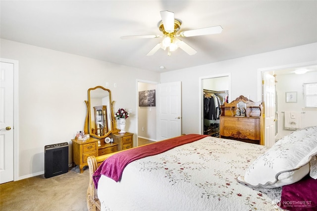 1811 Hundley Rd, Cle Elum, WA 98922 - bedroom featuring light carpet, a walk in closet, a closet, connected bathroom, and a ceiling fan