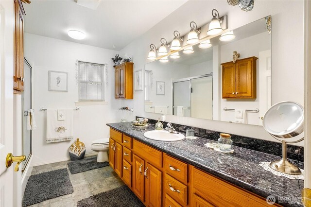 1811 Hundley Rd, Cle Elum, WA 98922 - bathroom with a stall shower, vanity, toilet, and baseboards
