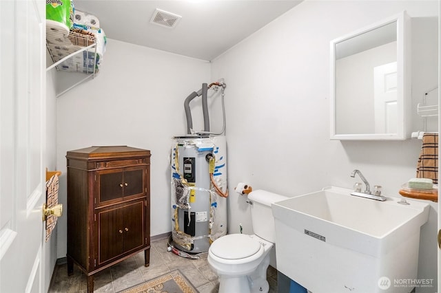 1811 Hundley Rd, Cle Elum, WA 98922 - half bathroom with secured water heater, a sink, and toilet