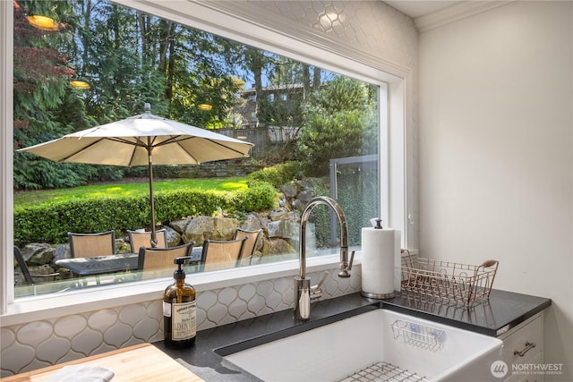 9209 SE 57th St, Mercer Island, WA 98040 - kitchen view of a sink, dark countertops, stucco siding, and white cabinets
