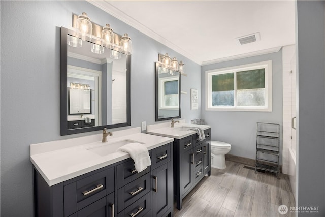 9209 SE 57th St, Mercer Island, WA 98040 - full bathroom with toilet, crown molding, vanity, wood finished floors, and baseboards