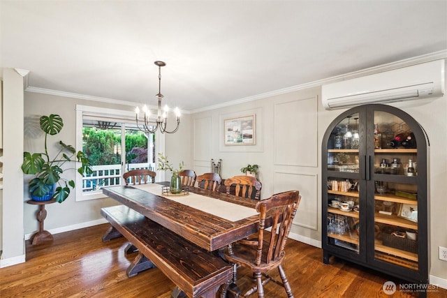 4279 H Street Rd, Blaine, WA 98230 - dining space featuring a wall mounted air conditioner, a chandelier, dark wood-style flooring, baseboards, and crown molding