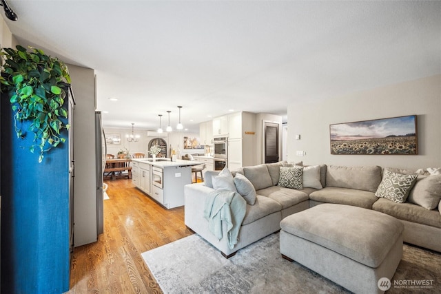 4279 H Street Rd, Blaine, WA 98230 - living room with light wood-style floors, a chandelier, and recessed lighting