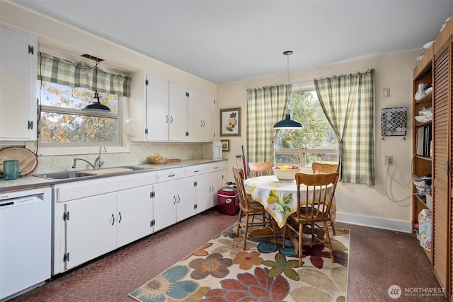 5367 Barr Rd, Ferndale, WA 98248 - kitchen featuring white dishwasher, a sink, white cabinetry, and light countertops
