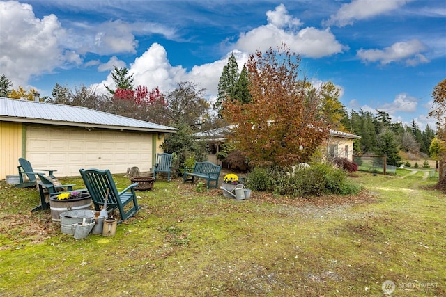 5367 Barr Rd, Ferndale, WA 98248 - view of grassy yard featuring a fire pit and an outdoor structure