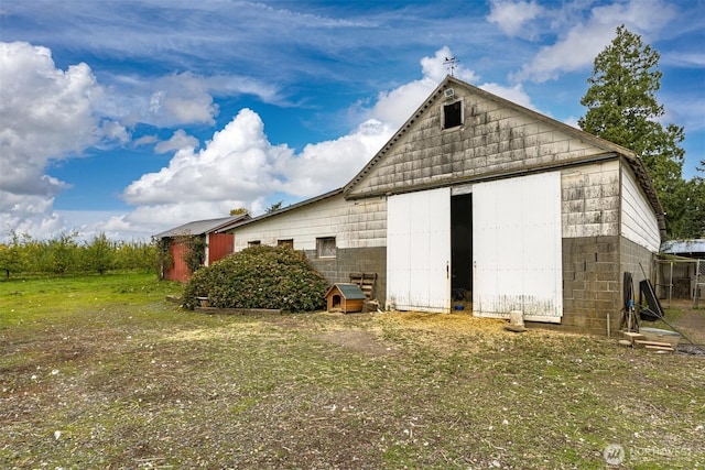 5367 Barr Rd, Ferndale, WA 98248 - back of property featuring an outbuilding and concrete block siding