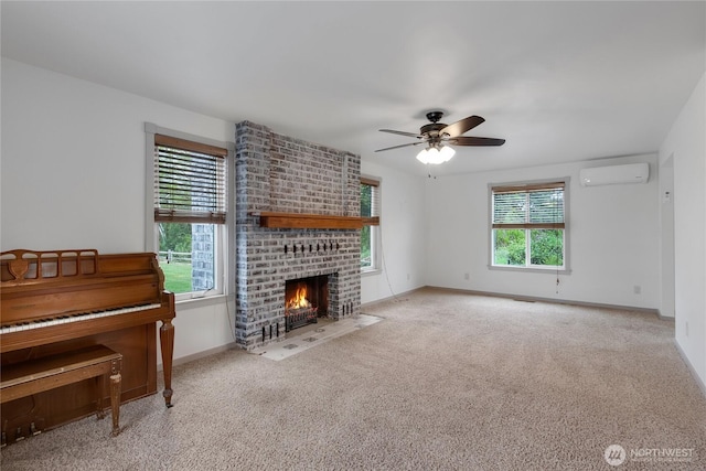 211 Blake St, Enumclaw, WA 98022 - carpeted living room featuring an AC wall unit, ceiling fan, a fireplace, and baseboards