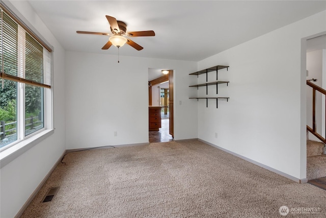 211 Blake St, Enumclaw, WA 98022 - spare room with ceiling fan, carpet, stairway, and baseboards