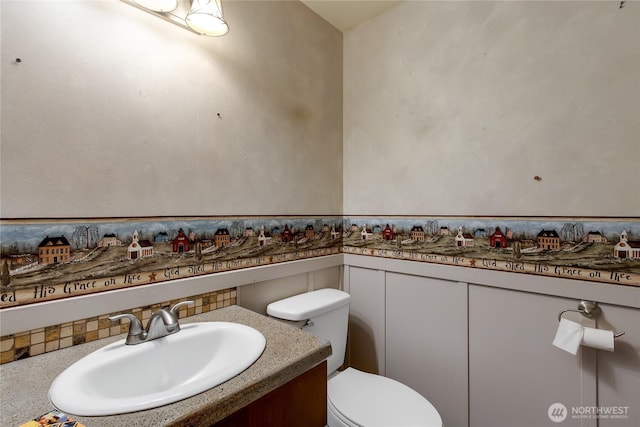 211 Blake St, Enumclaw, WA 98022 - bathroom featuring toilet, vanity, and a wainscoted wall