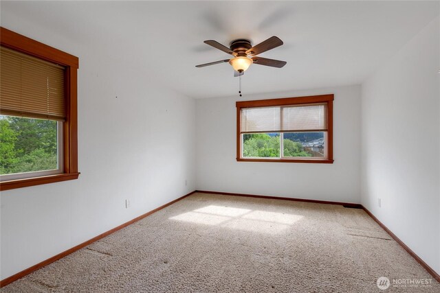211 Blake St, Enumclaw, WA 98022 - carpeted empty room featuring ceiling fan and baseboards