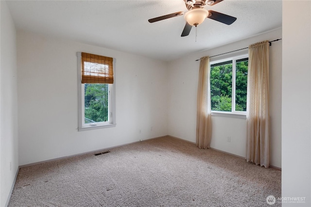 211 Blake St, Enumclaw, WA 98022 - carpeted spare room featuring a ceiling fan