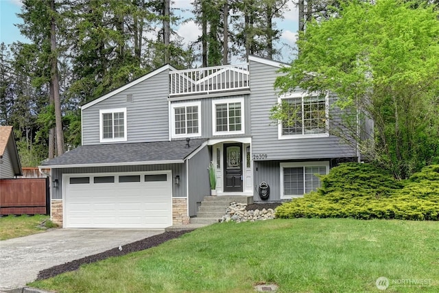 26309 187th Ct SE, Covington, WA 98042 - view of front facade with a balcony, an attached garage, concrete driveway, a front yard, and stone siding