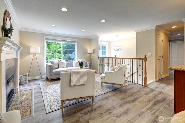 26309 187th Ct SE, Covington, WA 98042 - living area with crown molding, a chandelier, baseboards, a fireplace with flush hearth, and wood finished floors