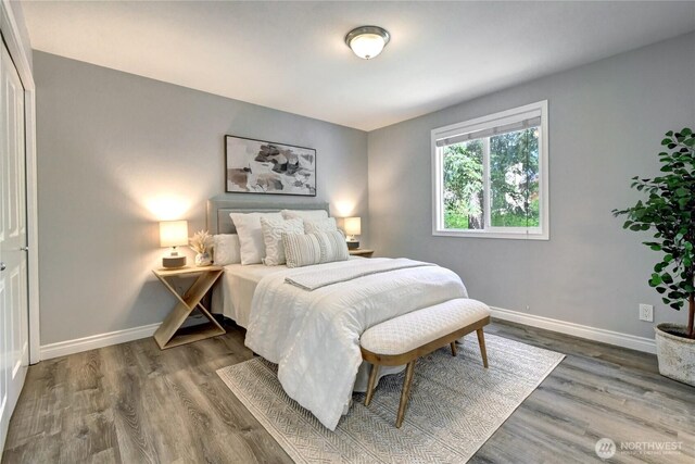 26309 187th Ct SE, Covington, WA 98042 - bedroom featuring baseboards and wood finished floors