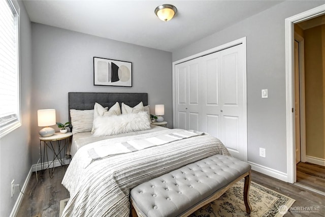 26309 187th Ct SE, Covington, WA 98042 - bedroom with baseboards, a closet, wood finished floors, and multiple windows
