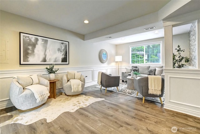 26309 187th Ct SE, Covington, WA 98042 - living room featuring a decorative wall, wood finished floors, wainscoting, and recessed lighting