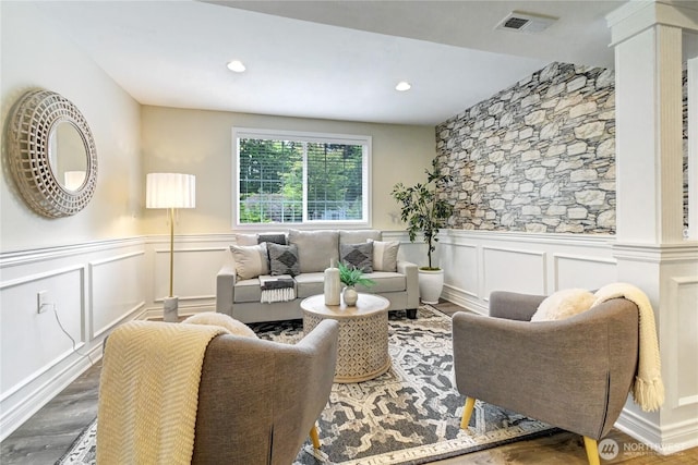 26309 187th Ct SE, Covington, WA 98042 - living room featuring a decorative wall, a wainscoted wall, decorative columns, wood finished floors, and recessed lighting