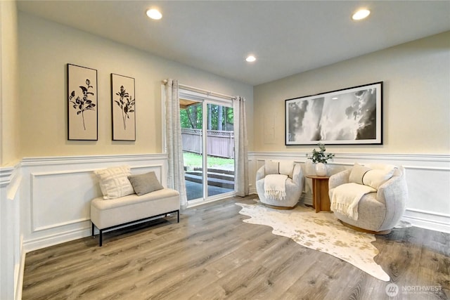 26309 187th Ct SE, Covington, WA 98042 - living area with a decorative wall, wainscoting, recessed lighting, and wood finished floors