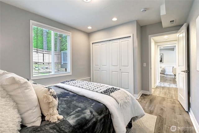 26309 187th Ct SE, Covington, WA 98042 - bedroom featuring light wood-style floors, a closet, recessed lighting, and baseboards