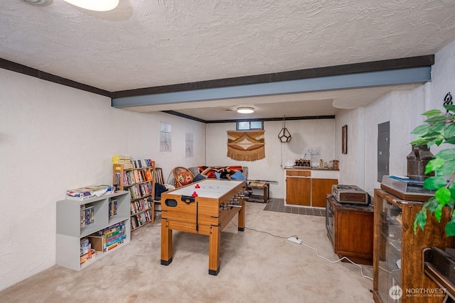 517 Marginal Way, Quincy, WA 98848 - recreation room with beam ceiling, a textured ceiling, and light colored carpet