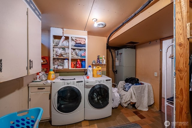 517 Marginal Way, Quincy, WA 98848 - clothes washing area featuring washing machine and clothes dryer, cabinet space, and tile patterned floors