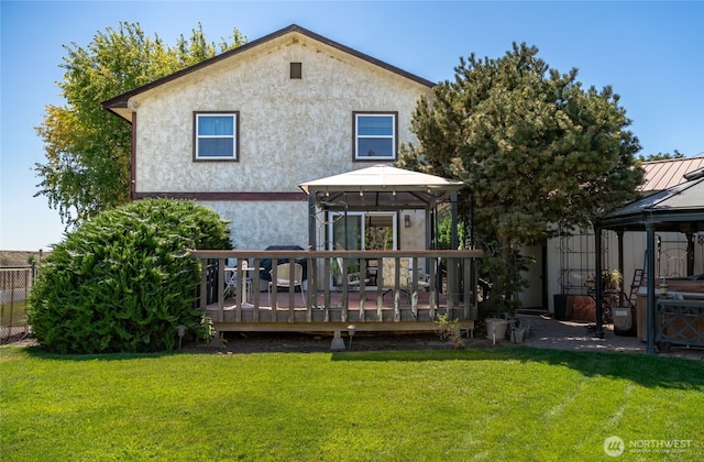 517 Marginal Way, Quincy, WA 98848 - back of house featuring a gazebo, a wooden deck, and stucco siding