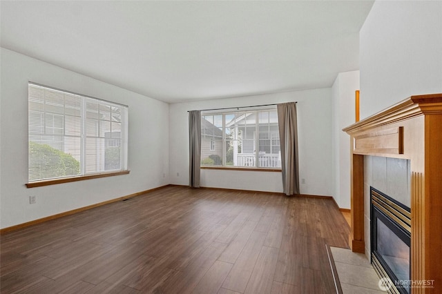 1114 Sinclair Way Unit 63, Burlington, WA 98233 - unfurnished living room featuring a fireplace, light wood-type flooring, and baseboards