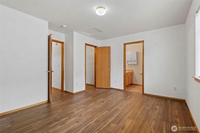 1114 Sinclair Way Unit 63, Burlington, WA 98233 - unfurnished bedroom with light wood-style floors, baseboards, ensuite bathroom, and a closet