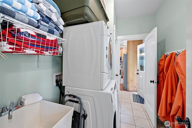 251 Meriweather St, Pacific Beach, WA 98571 - washroom featuring stacked washer and clothes dryer and light tile patterned floors