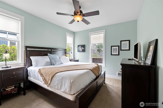 251 Meriweather St, Pacific Beach, WA 98571 - carpeted bedroom featuring multiple windows, baseboards, and ceiling fan