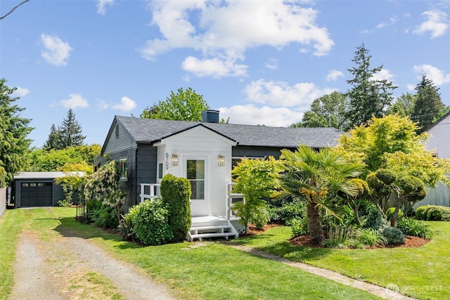 6709 E I St, Tacoma, WA 98404 - bungalow with dirt driveway, a front yard, a shingled roof, and a garage