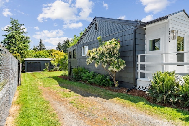 6709 E I St, Tacoma, WA 98404 - view of side of property with driveway and fence