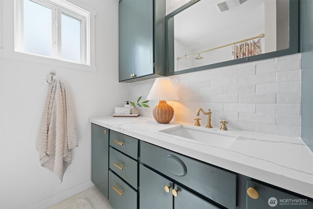 6709 E I St, Tacoma, WA 98404 - full bathroom with backsplash, vanity, and baseboards