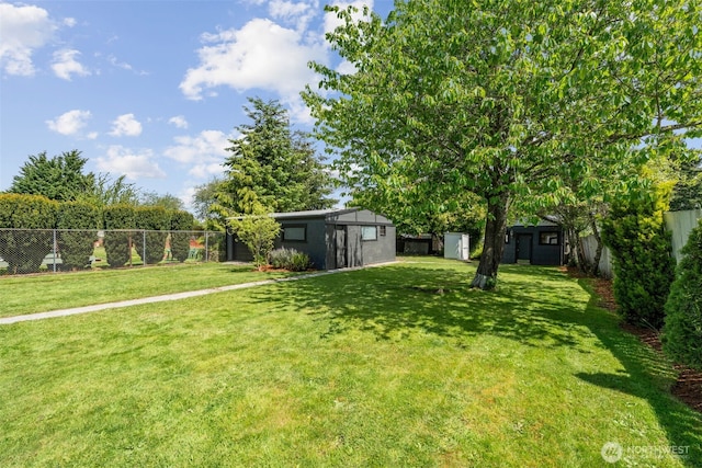 6709 E I St, Tacoma, WA 98404 - view of yard with an outdoor structure and a storage unit