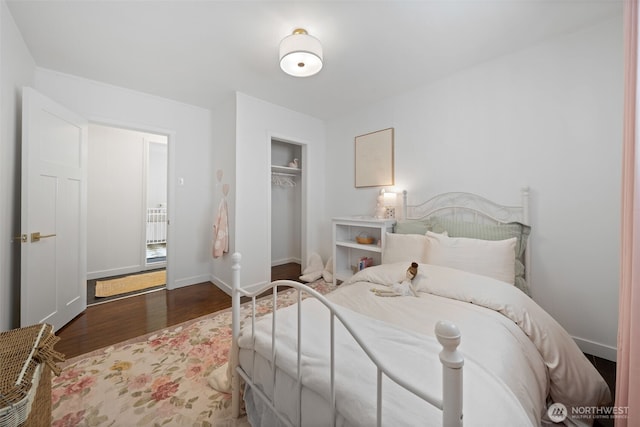6709 E I St, Tacoma, WA 98404 - bedroom with wood finished floors, a closet, and baseboards
