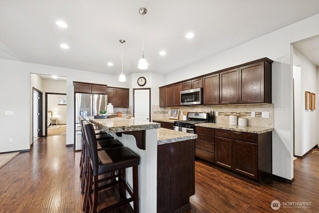 1310 Maple Ave, Snohomish, WA 98290 - kitchen featuring stainless steel appliances, dark brown cabinets, backsplash, dark wood-style floors, and recessed lighting