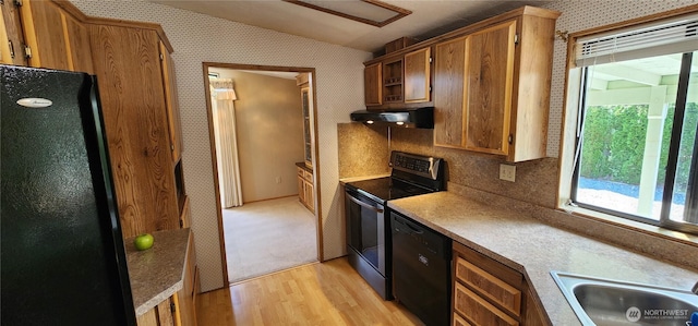 82 Marjory Ln, Sequim, WA 98382 - kitchen with black appliances, under cabinet range hood, light wood-style floors, lofted ceiling, and wallpapered walls