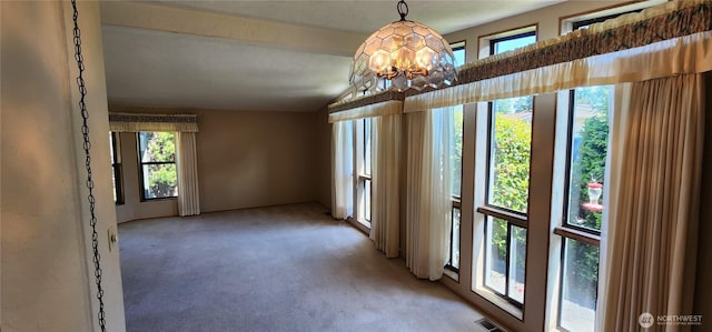 82 Marjory Ln, Sequim, WA 98382 - empty room with plenty of natural light, light carpet, and a chandelier