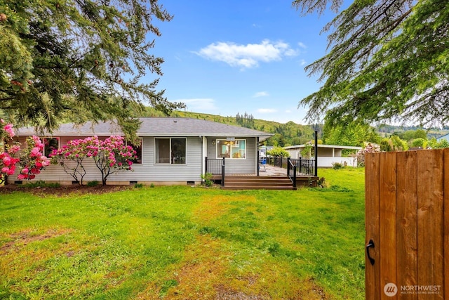5809 162nd Ave E, Sumner, WA 98390 - rear view of house with crawl space, a wooden deck, and roof with shingles